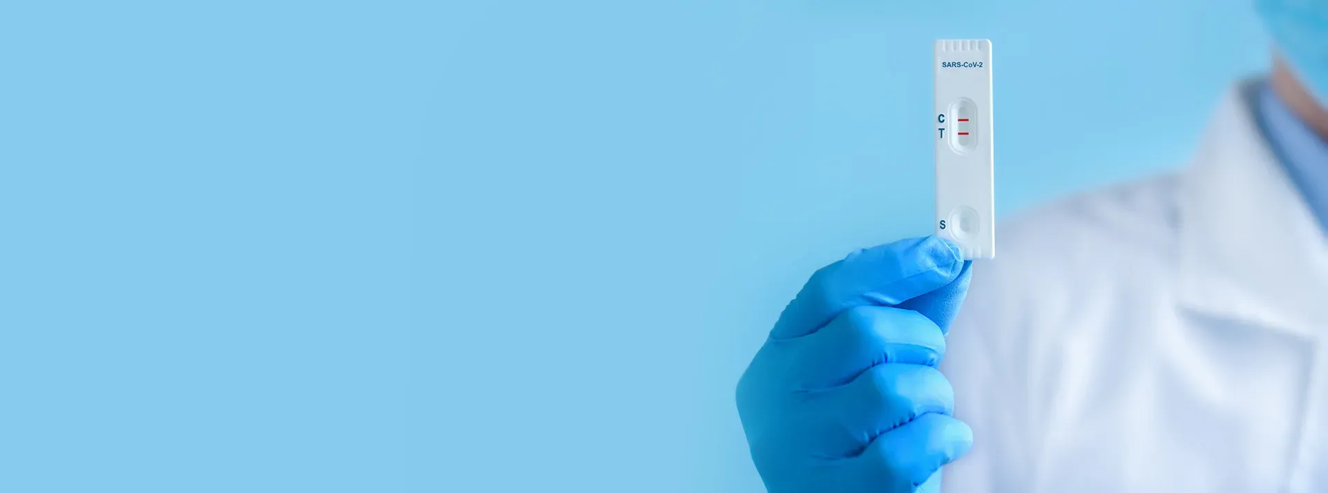 Laboratory professional holding a SARS-CoV-2 rapid test